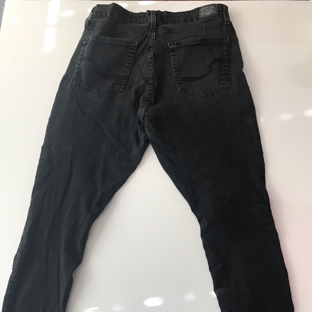 Levi’s black mid rise skinny jeans